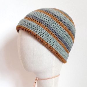 Merino Haube Kakadu in GOTS zertifizierter, nachhaltiger top Qualität. Handarbeit aus Österreich